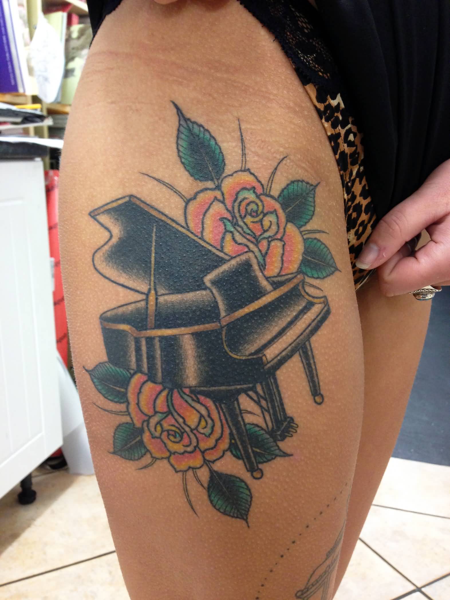 Nice Grand Piano With Flowers Traditional Tattoo On Thigh