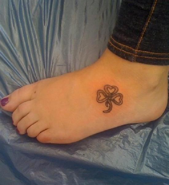 Nice Grey Celtic Shamrock Tattoo On Foot