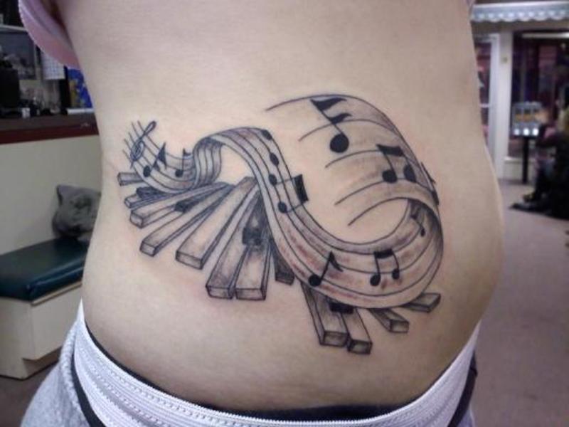Nice Grey Color Music Notes With Piano Keys Tattoo On Side Rib