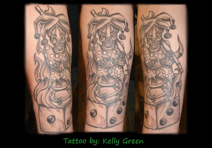 Nice Grey Ink Dice And Jester Tattoo On Arm Sleeve