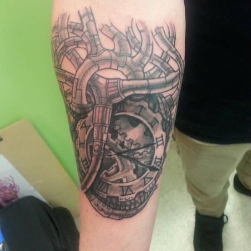 Nice Grey Mechanical Gears Clock Tattoo On Bicep