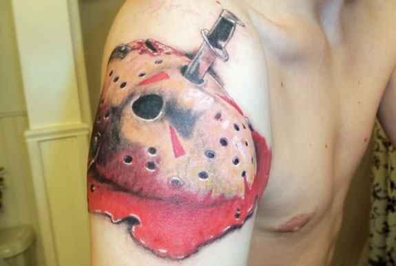 Nice Jason Mask With Knife In One Eye Tattoo On Right Shoulder
