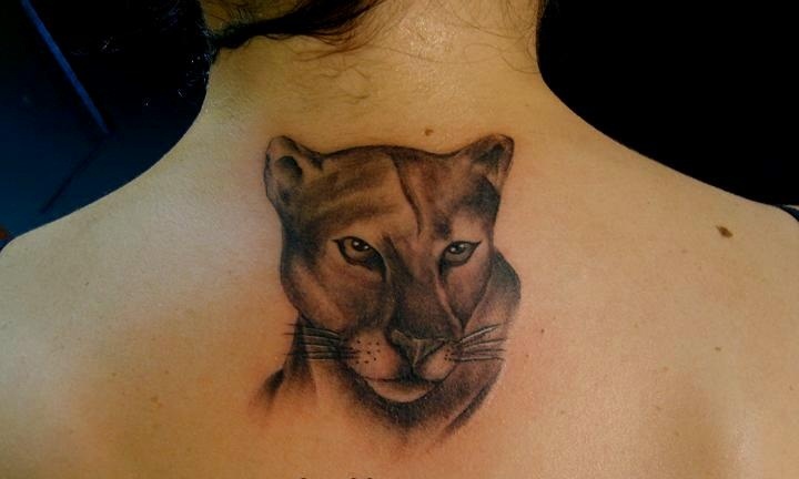 Nice Puma Head Tattoo On Upper Back