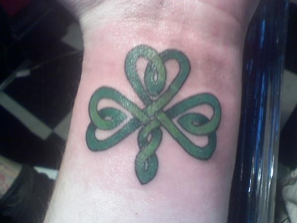 Nice Shamrock In Celtic Style Tattoo On Wrist