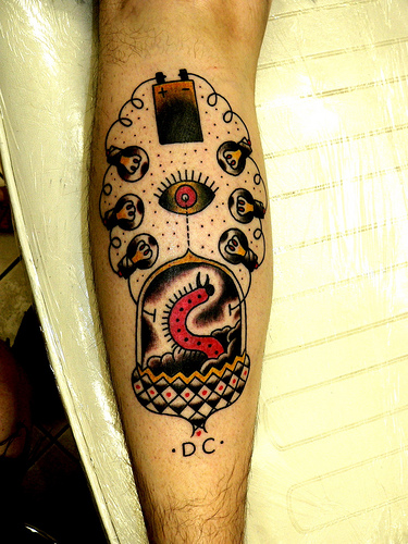 Nice Traditional Worm With Bulbs Tattoo On Forearm