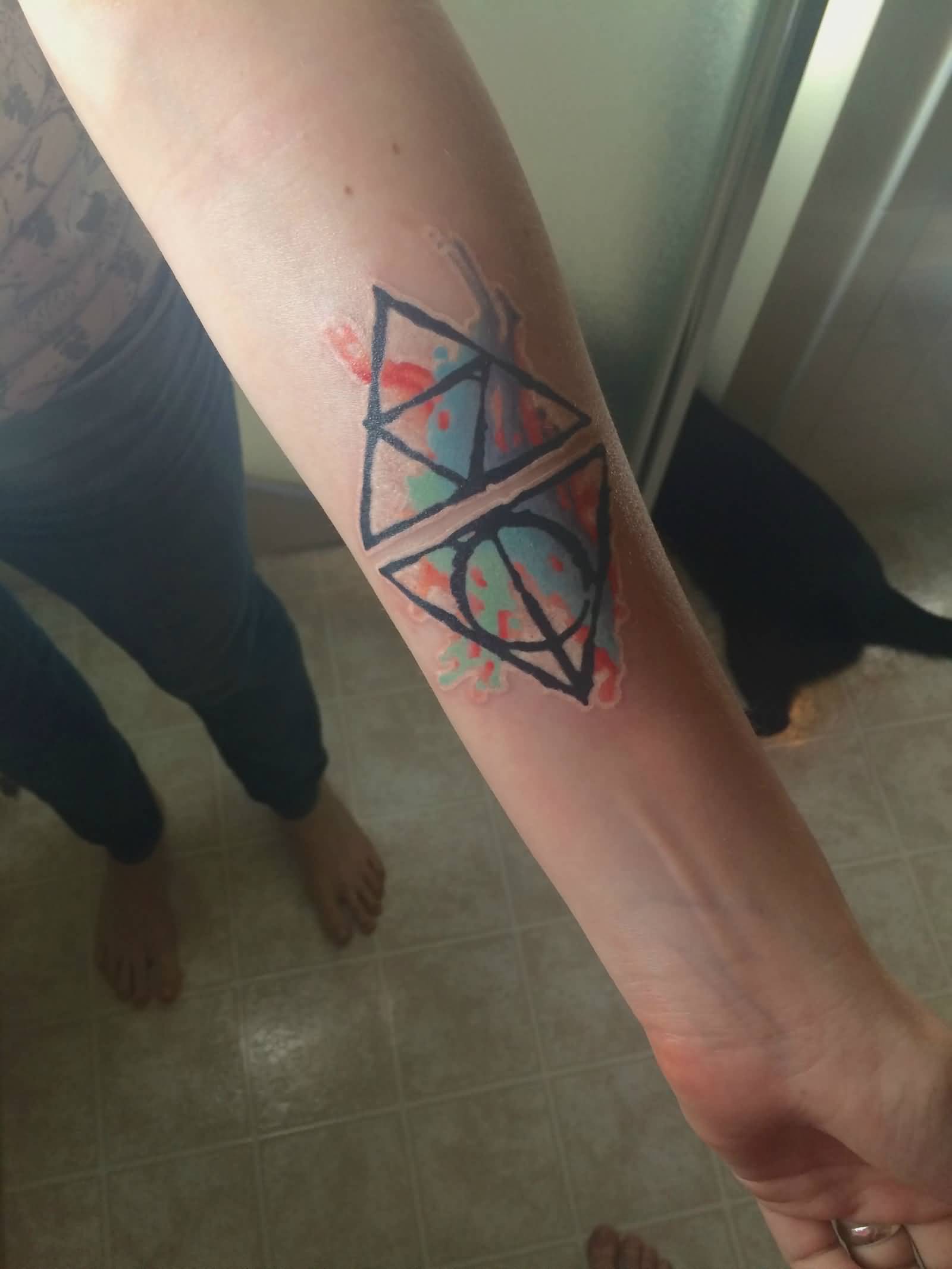Nice Triforce Hallows Watercolor Tattoo On Forearm
