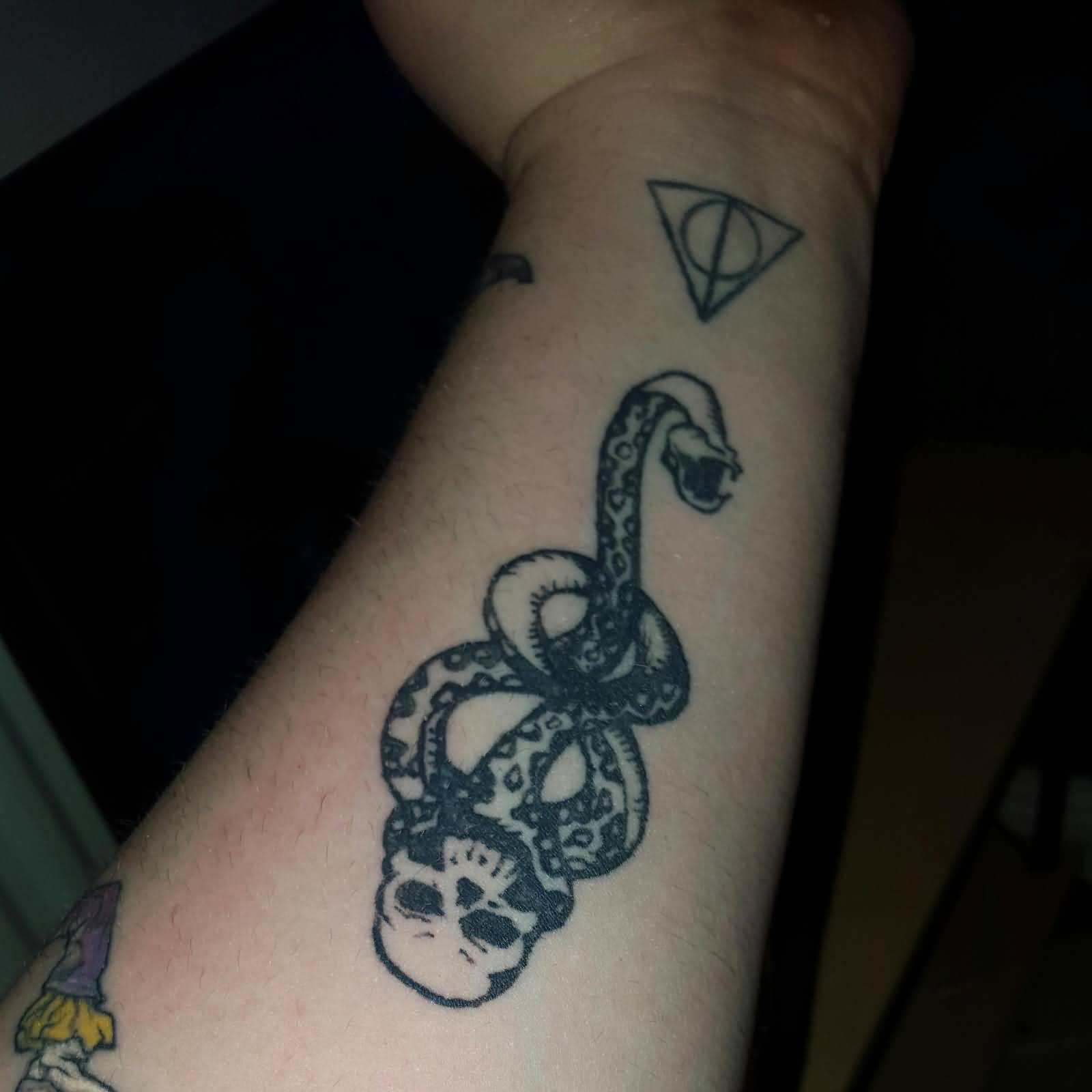Nice Voldemort Symbol With Deathly Hallows Tattoo On Forearm