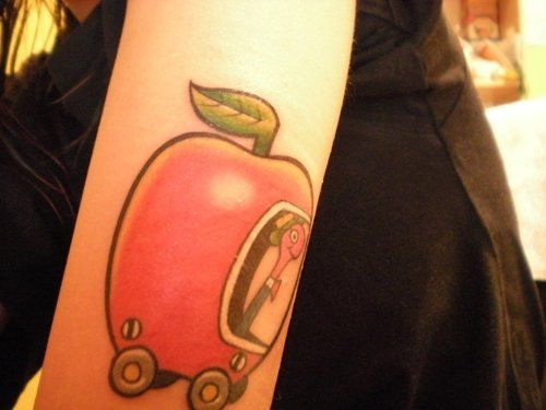 Nice Worm In Apple Cart Tattoo