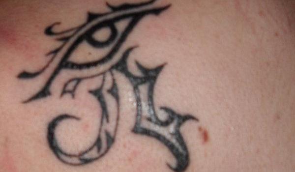 Nicely Designed Black Horus Eye Tattoo