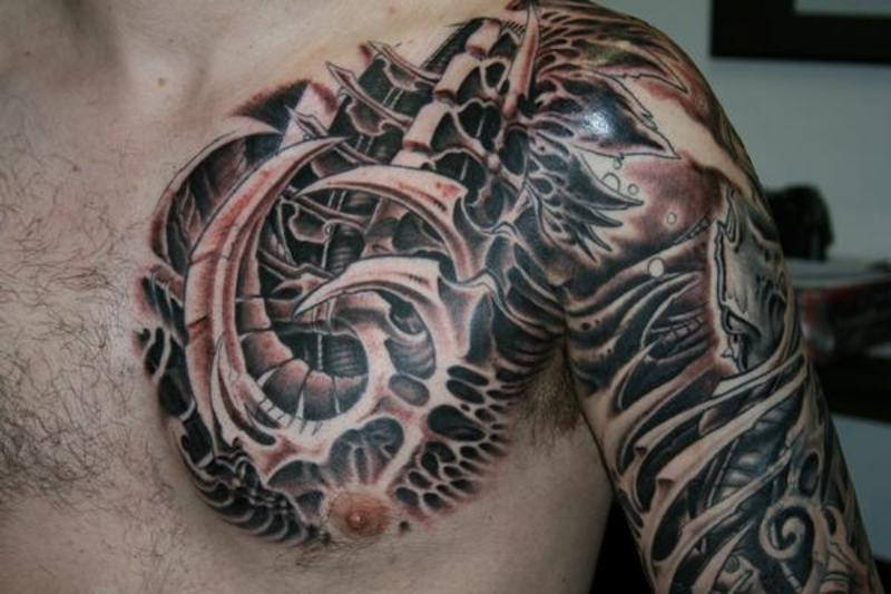 Outstanding Biomechanical Tattoo On Chest To Arm