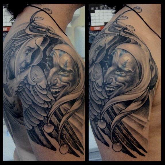 Outstanding Grey Ink Angel And Jester Tattoo On Right Shoulder