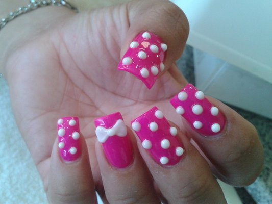 Pink Nails With White Polka Dots And 3D Bow Nail Art