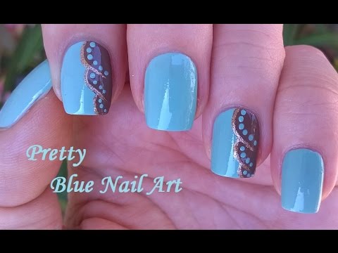 Pretty Light Blue Nail Art With Brown And Gold Design