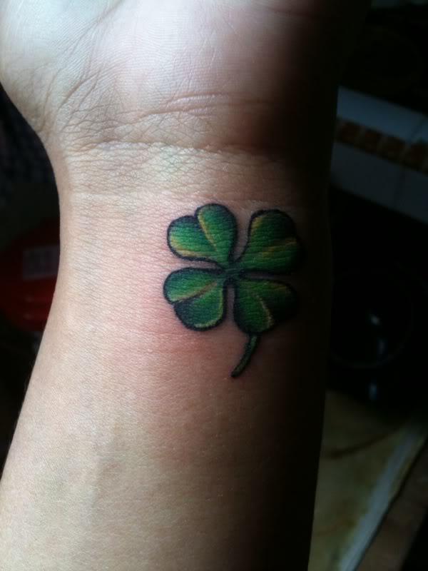 Pretty Small Four Leaf Shamrock Tattoo On Wrist