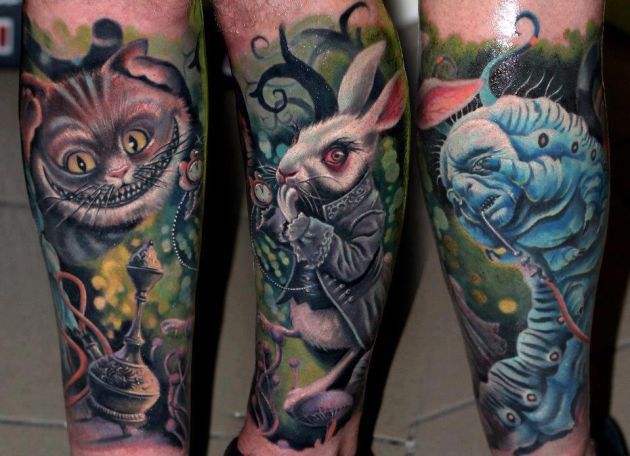 Realistic Cartoon Worm With Cat And Rabbit Tattoo