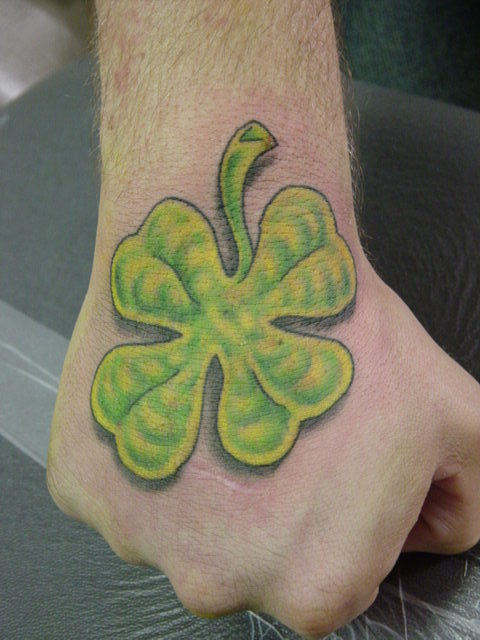 Realistic Four Leaf Shamrock Tattoo On Hand