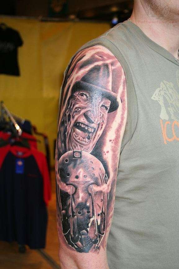 Realistic Grey Freddy And Jason With Smoke Tattoo On Right Half Sleeve
