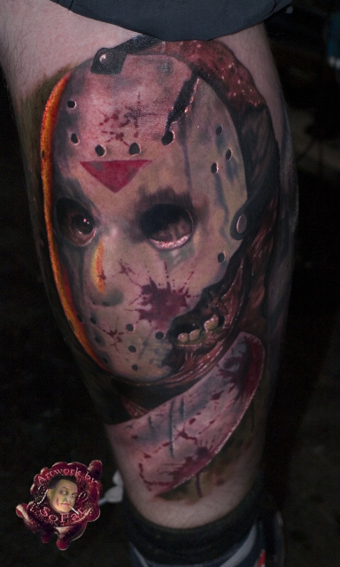 Realistic Scary Jason Head With Sword Tattoo On Thigh