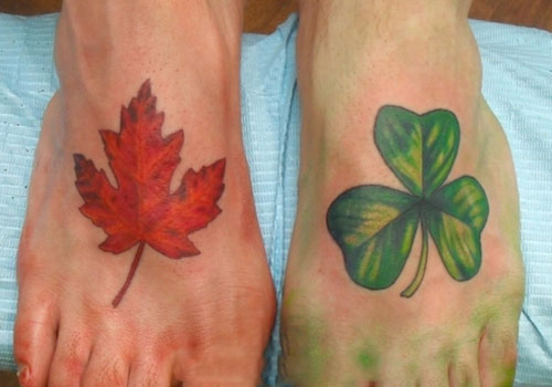 Realistic Shamrock With Autumn Leaves Tattoo On Foots