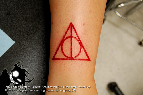 Red Color Deathly Hallows Symbol Tattoo