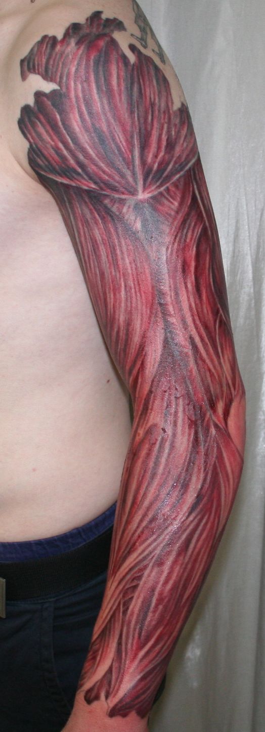 Red Color Muscles Full Sleeve Tattoo By 2Face