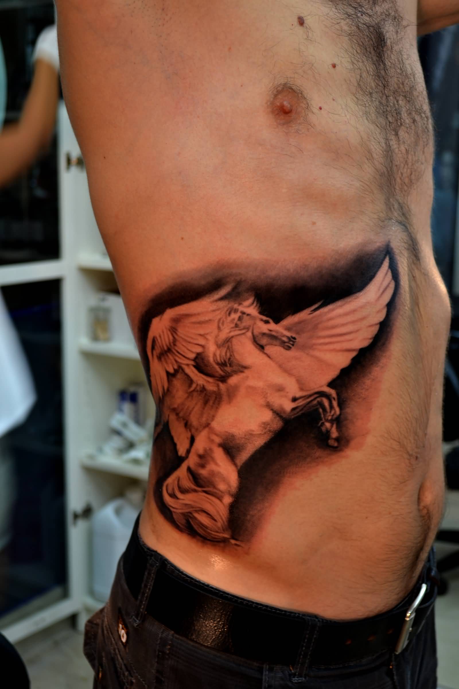 Red Ink Pegasus Tattoo On Side Rib By Metetngz