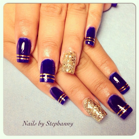 Royal Blue Nails With Gold Stripes Design