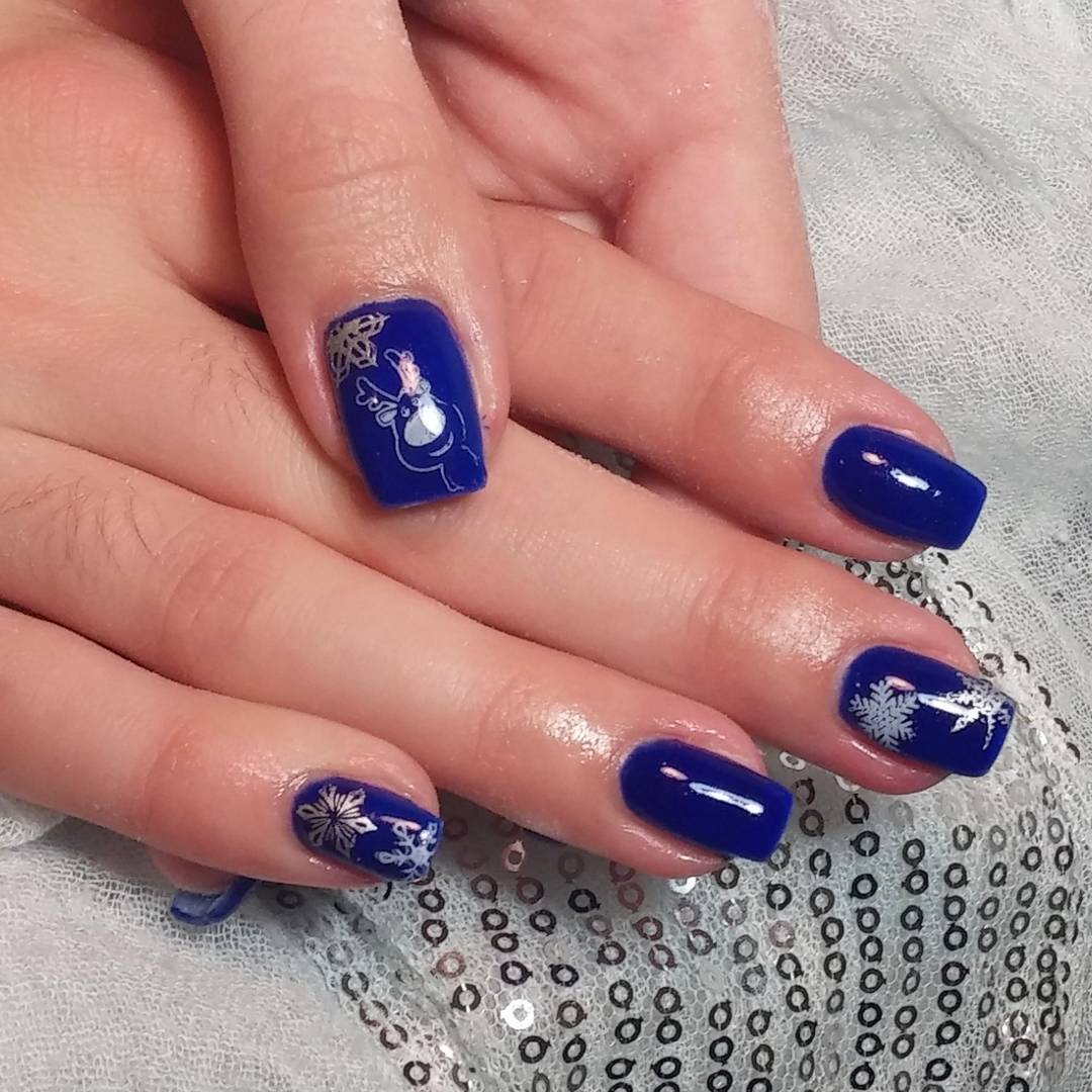 Royal Blue Nails With Reindeer And Snowflakes Design Idea