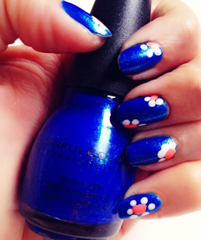 Royal Blue Nails With White And Pink Floral Nail Art