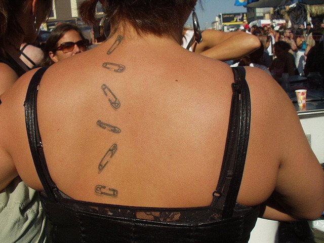 Safety Pins Tattoo On Upper Back For Girls