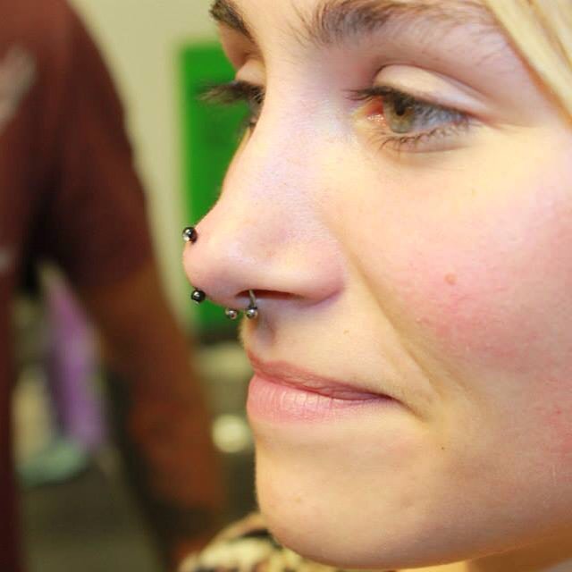 Septum And Rhino Piercing With Curved Barbell