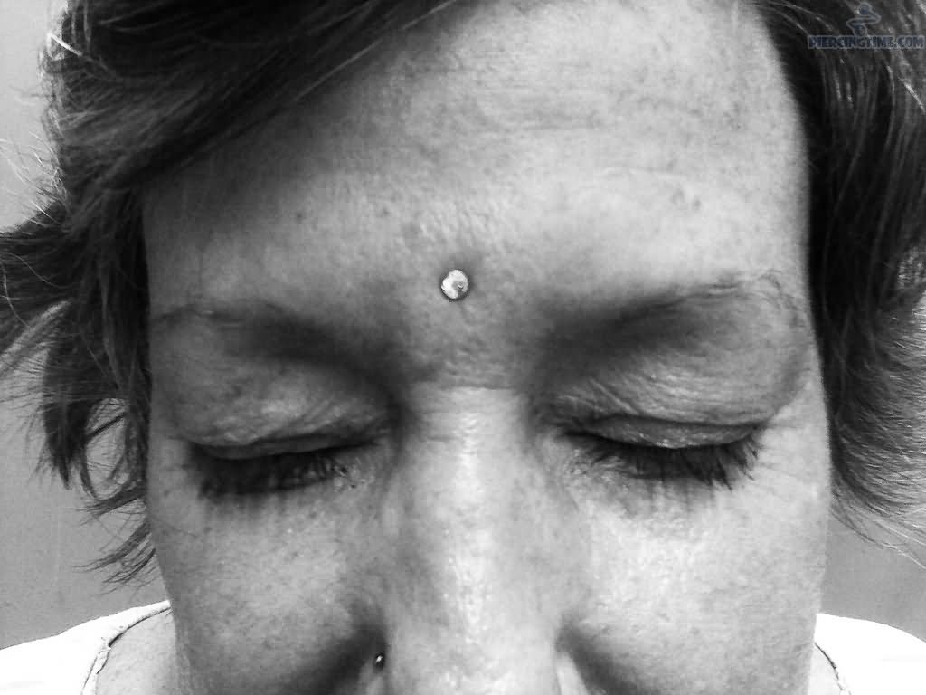 Silver Dermal Third Eye Piercing For Women