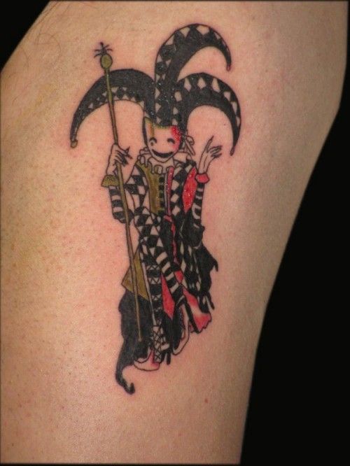 Simple And Small Jester In Mask Colorful Tattoo