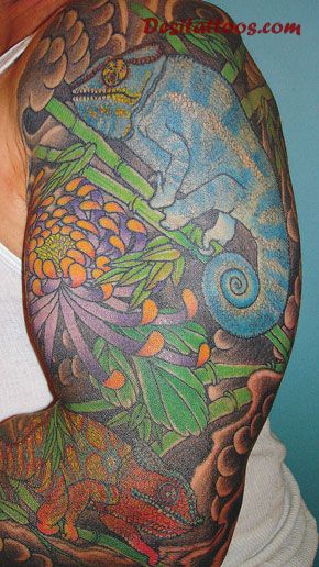 Simple Colored Reptile Lizard And Flowers Tattoo On Sleeve