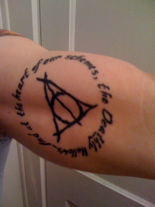 Simple Deathly Hallows In Quote Circle Tattoo On Bicep