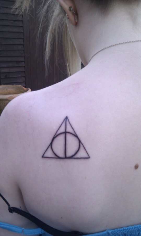Simple Deathly Hallows Tattoo On Upper Back Shoulder