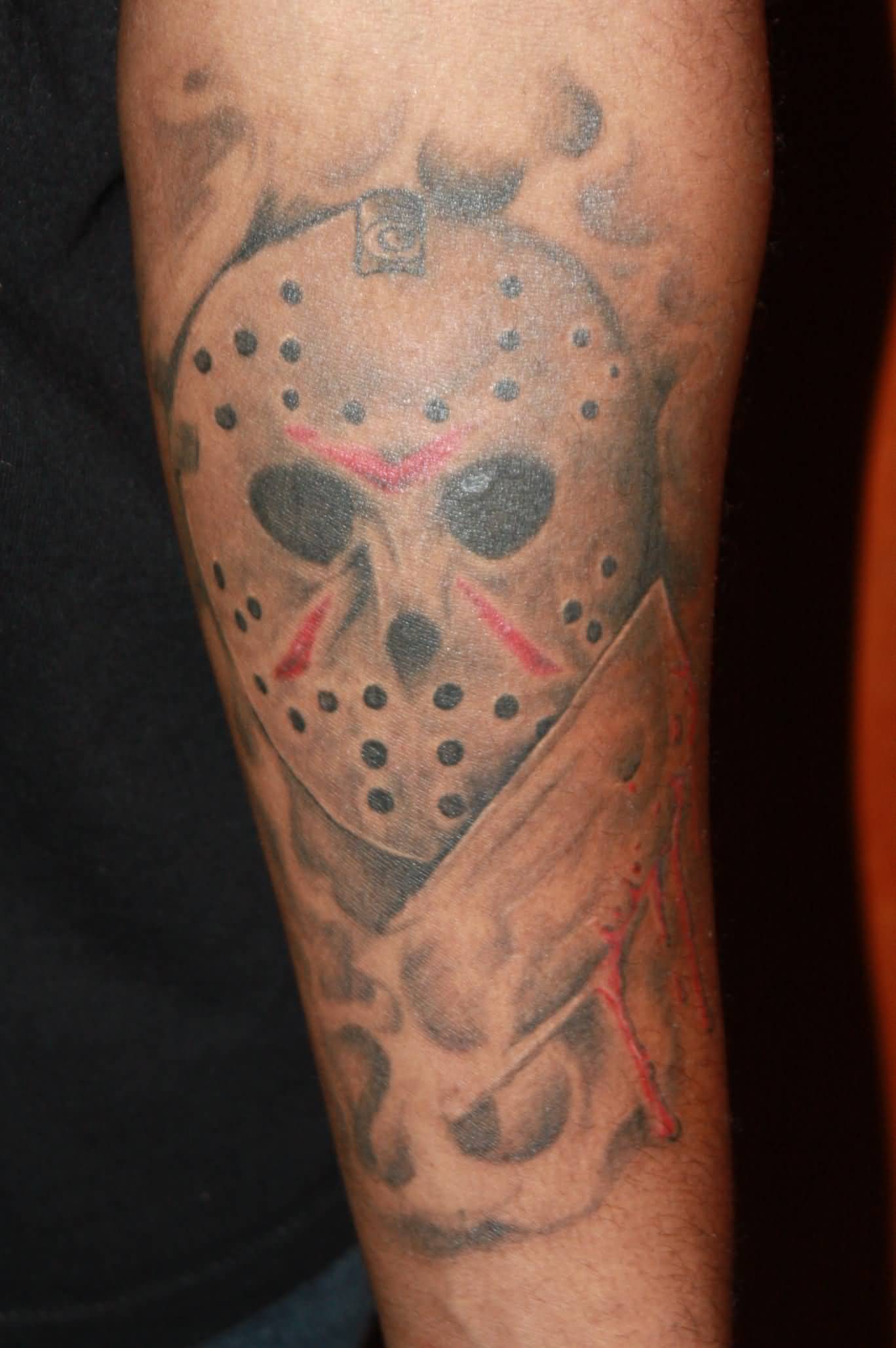Simple Grey Jason Mask With Knife Tattoo On Arm Sleeve