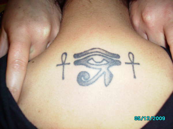 Simple Horus Eye With Two Ankhs Tattoo On Upper Back