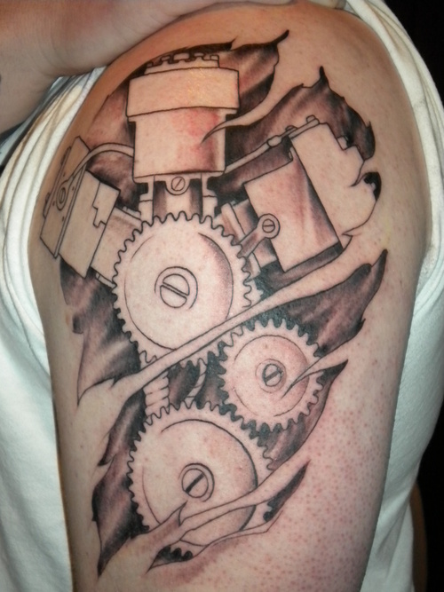 Simple Mechanical Gears Ripped Skin Tattoo On Left Shoulder