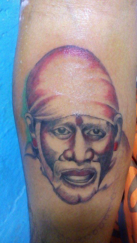 Simple Sai Baba Face Tattoo