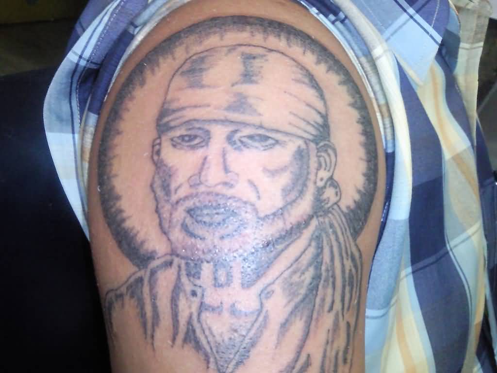 Simple Sai Baba With Circle Tattoo On Left Shoulder
