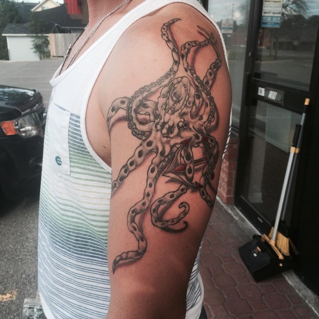 Simple Sea Creature Octopus With Anchor Left Shoulder Tattoo