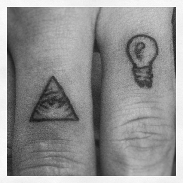 Simple Triangle Eye With Bulb Small Tattoos On Fingers