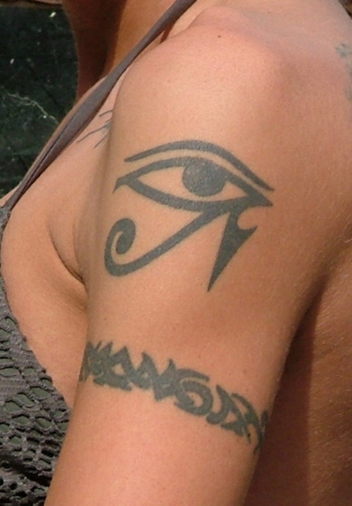 Simple Tribal Arm Band With Horus Eye Tattoo On Left Shoulder