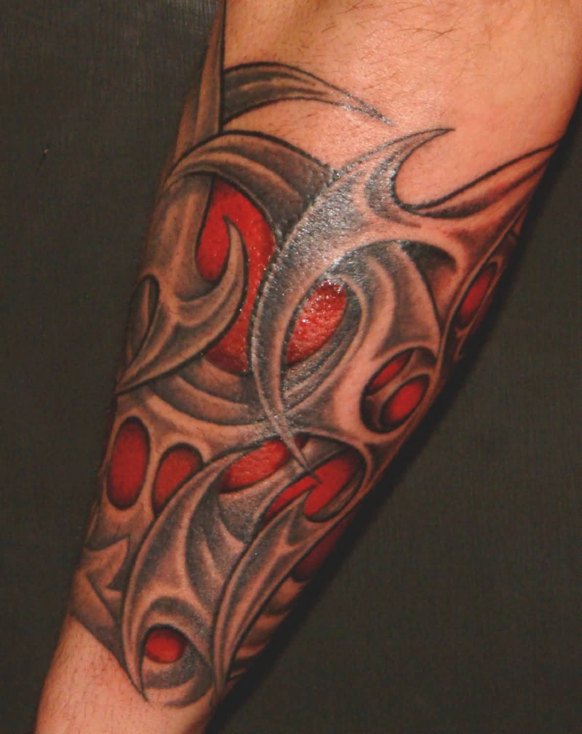 Simple Tribal Muscles Tattoo On Forearm