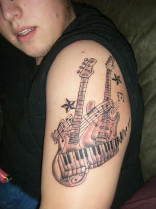 Simple Two Guitars And Piano Keys Tattoo On Left Shoulder