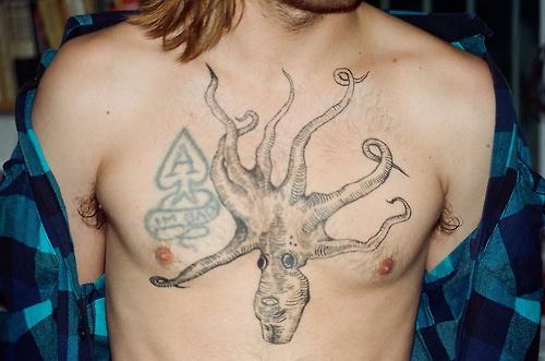 Simple Upside Down Octopus Sea Creature Chest Tattoo