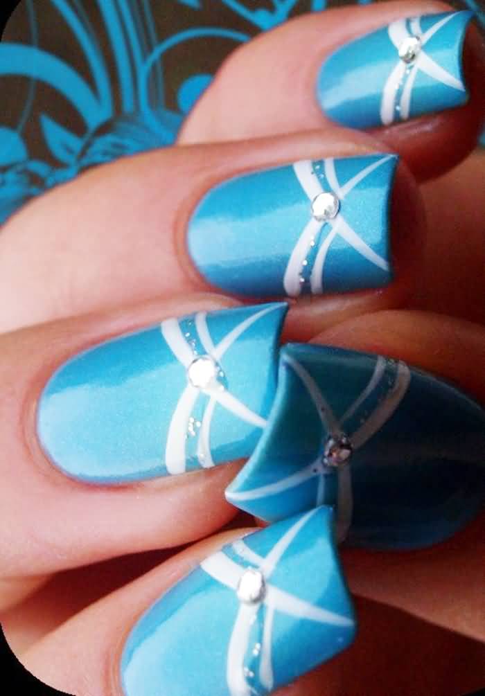 Sky Blue Nails With White Stripes And Rhinestones Design Idea