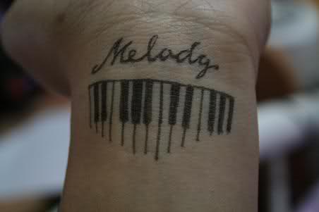 Small Melody Piano Keys Tattoo On Wrist