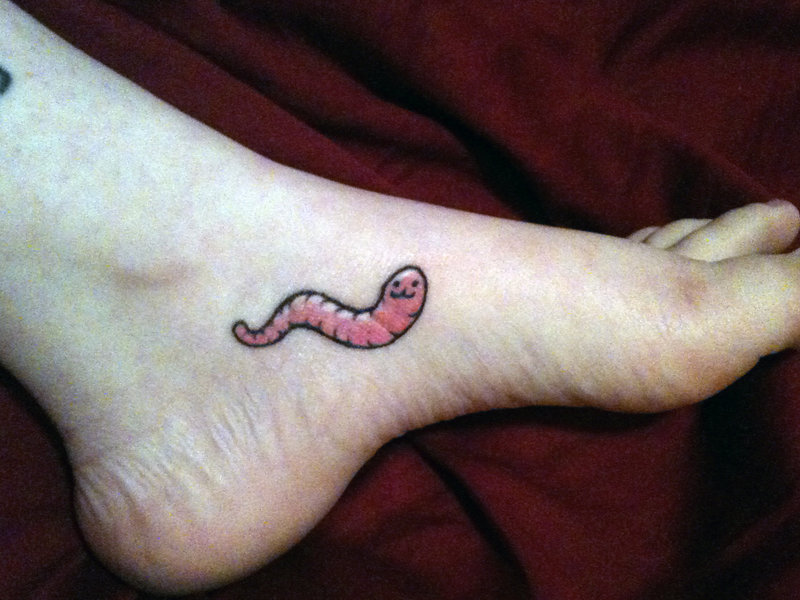 Small Pink Worm Tattoo On Left Foot